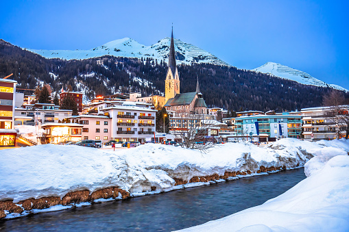 Idyllic mountain town of Davos in Swiss Alps evening view, luxury ski destination Davos Swiss